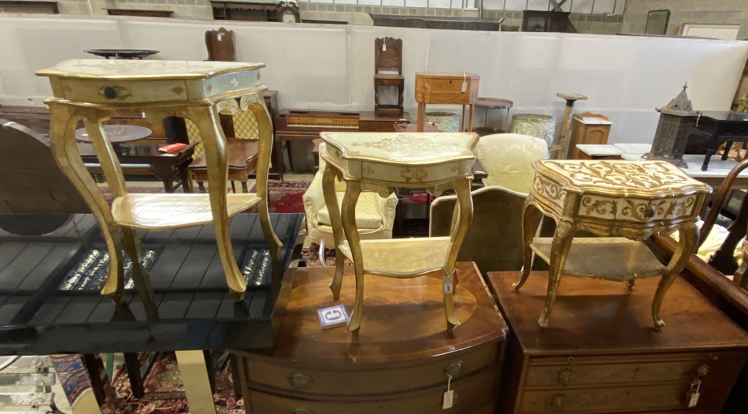 Three Italian gold painted parcel gilt serpentine bedside tables, largest 152cm, depth 32cm, height 63cm